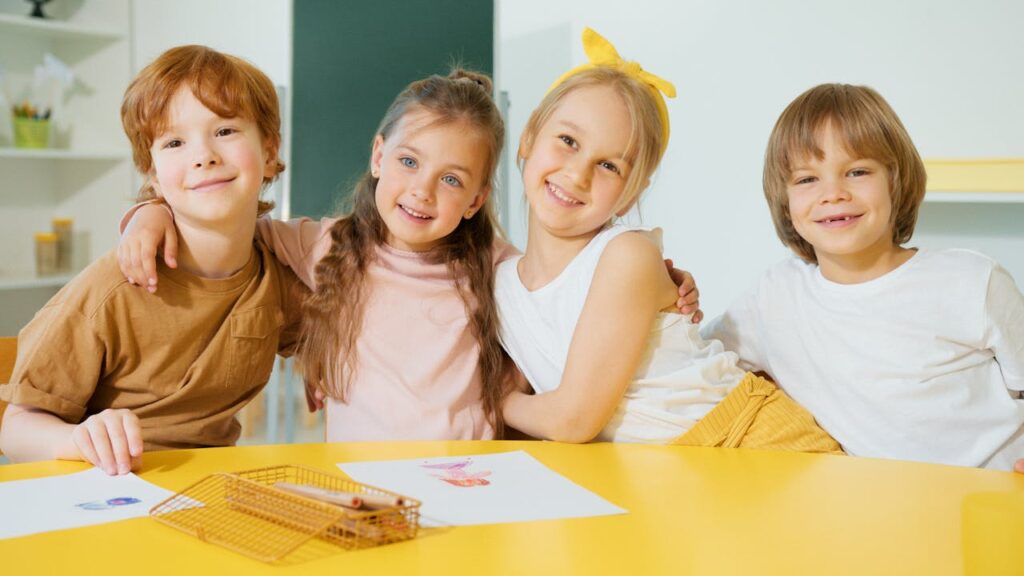 happy school children in a repainted classroom